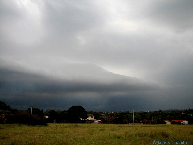 Weak gust front approaching. You can see some light smoke from a nearby fire in the photo.