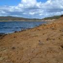 Cracked and dried soil now a few metres above the water line.