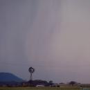 Rain begins to fall out of the base - behind a dodgy windmill