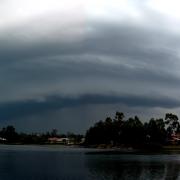 2 photos stitched together - gust front with landing pelican!