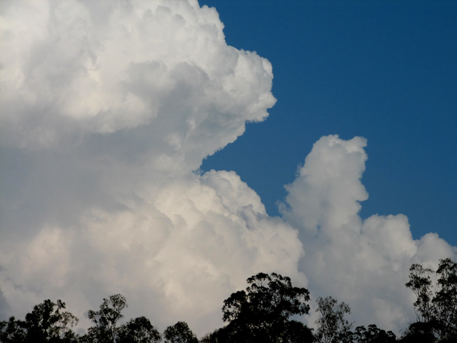 Cumuli development to the west of the storm.